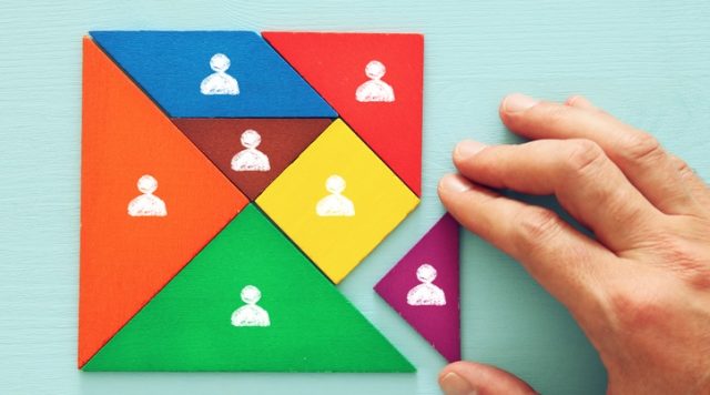 tangram puzzle blocks with people icons ,human resources and management concept.