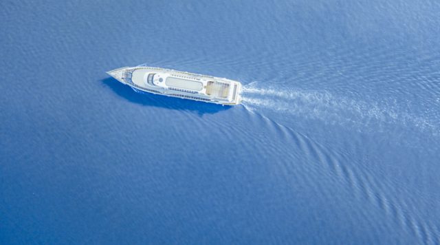 ship ferry in the city river aerial shot