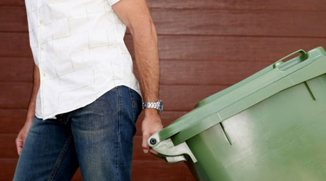 man-taking-the-garbage-out